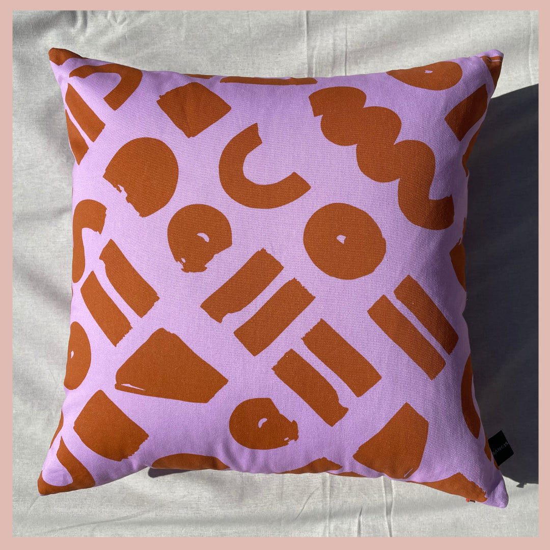 Love - pink and ocher geometric printed cushion